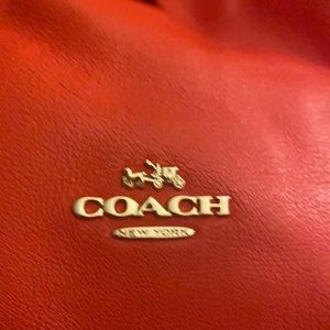 Coach purse-red leather-used liked new except pen mark inside near zipper